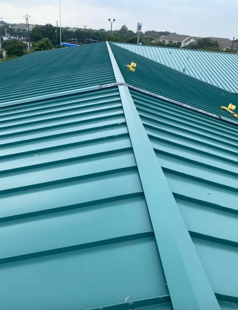 Green commercial metal roof ridge and valley for Metal Roof Repair in Plymouth